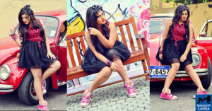 Shanudrie Priyasad Poses By A Red Volkswagen